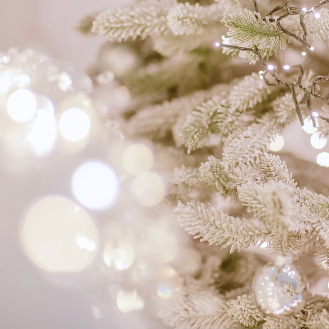 Image of silver and gold lights on a Christmas tree.