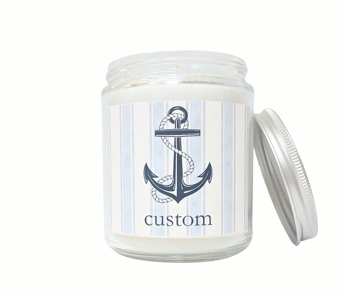 Custom 8oz coastal candle with blue striped label, anchor icon, and personalized beach town name, hand-poured in eco-friendly coconut wax.