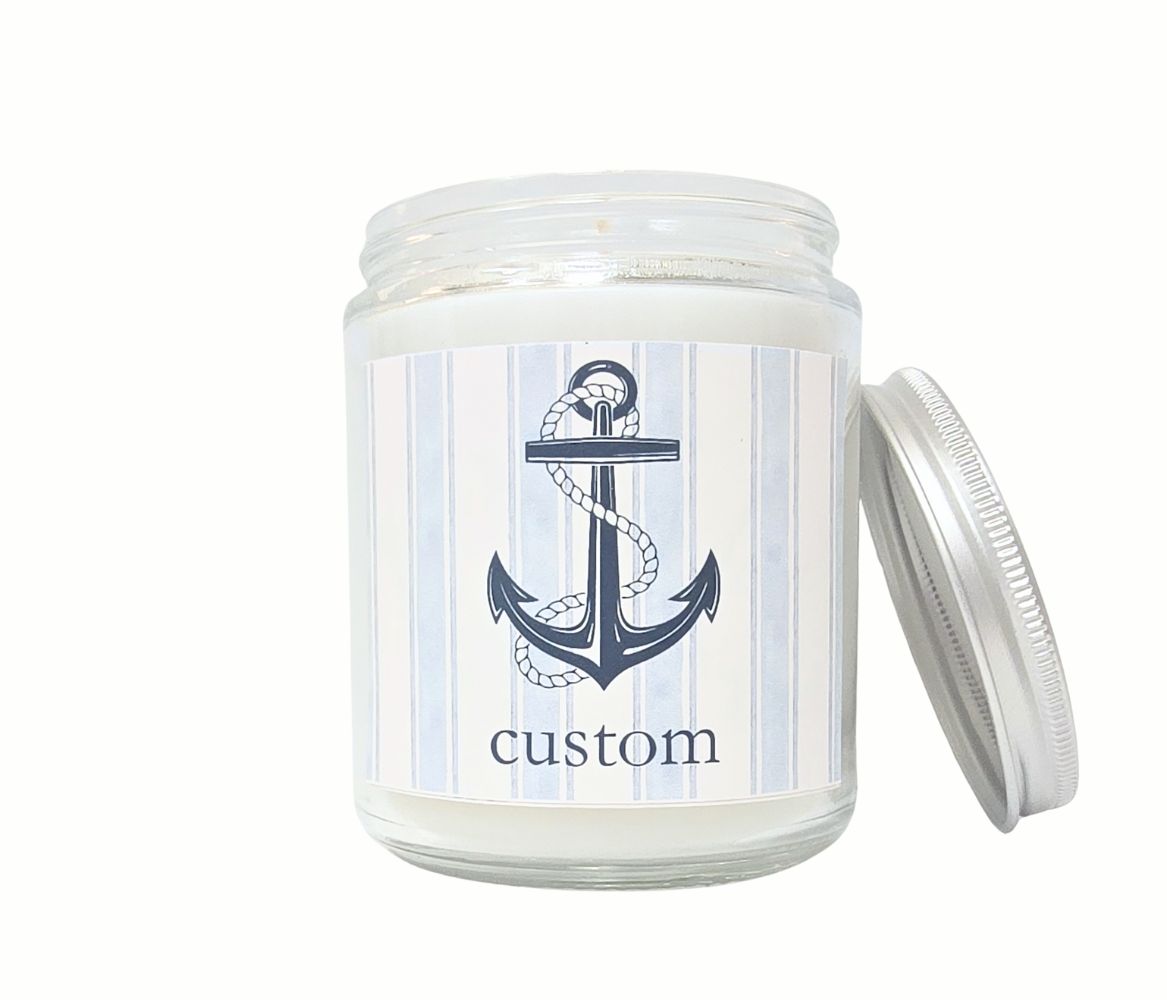 Custom 8oz coastal candle with blue striped label, anchor icon, and personalized beach town name, hand-poured in eco-friendly coconut wax.