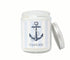 Custom 8oz coastal candle with blue striped label, anchor icon, and personalized beach town name, hand-poured in eco-friendly coconut wax.