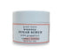 Front view of 9oz Pink Grapefruit Sugar Body Scrub jar with label, showcasing whipped texture and invigorating citrus scent, cleanses, exfoliates and hydrates skin.