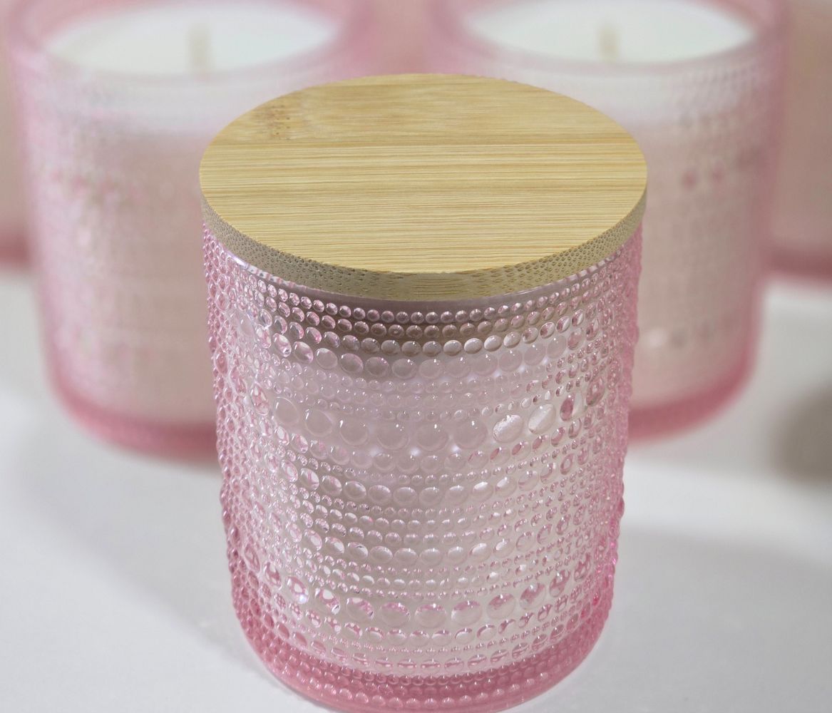 Limited edition pink floral candle with bamboo lid in reusable glass jar.