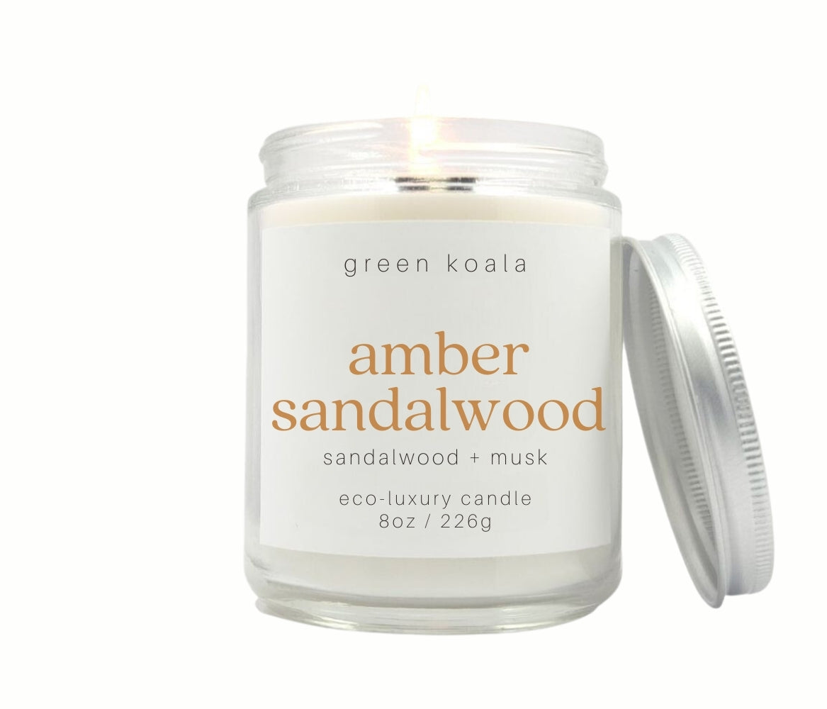Amber Sandalwood 8oz non-toxic coconut wax candle with silver lid.