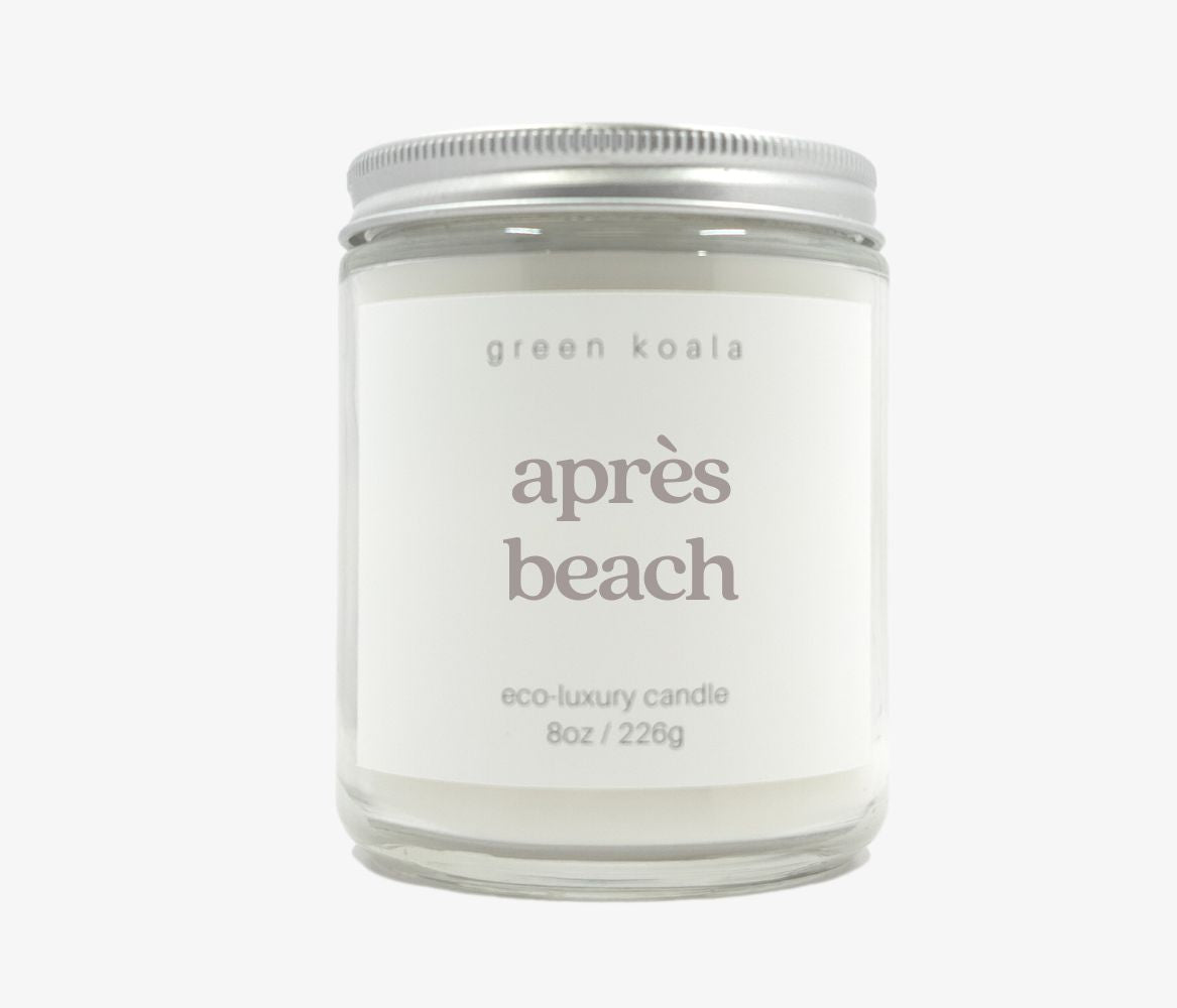 8oz Après Beach Candle in a glass jar with silver lid.
