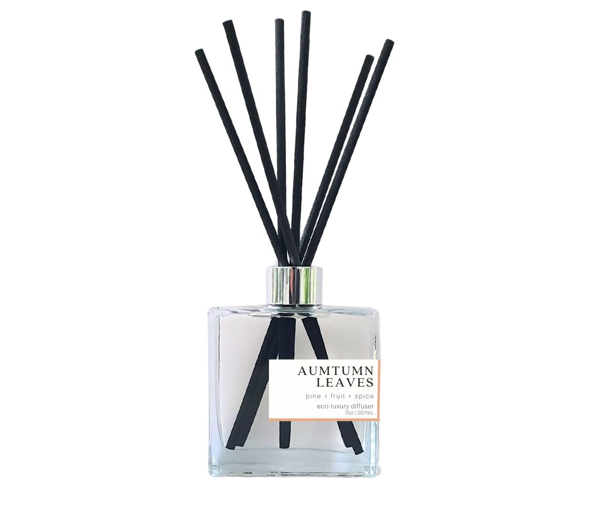 Crisp and earthy Autumn Leaves reed diffuser with black reeds in a glass bottle, evoking the beauty of the season.