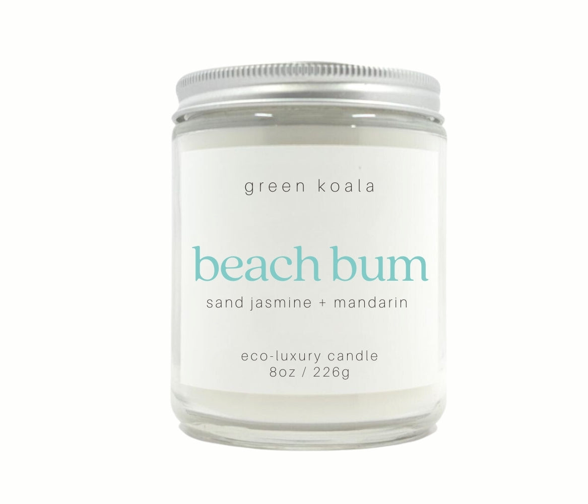 8oz Beach Bum scented non-toxic hand poured candle in a glass jar with silver lid.