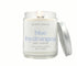 8oz Blue Hydrangea scented non-toxic candle in aglass jar with a silver lid.
