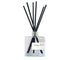 Blue Hydrangea reed diffuser in a glass bottle with black reeds, filling your space with a fresh floral scent.