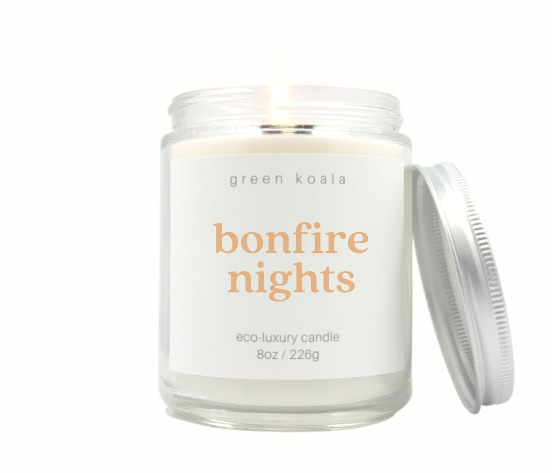 Green Koala 8oz bonfire nights candles in a glass jar. Cozy, smoky scent that brings the warmth of a bonfire to your space.