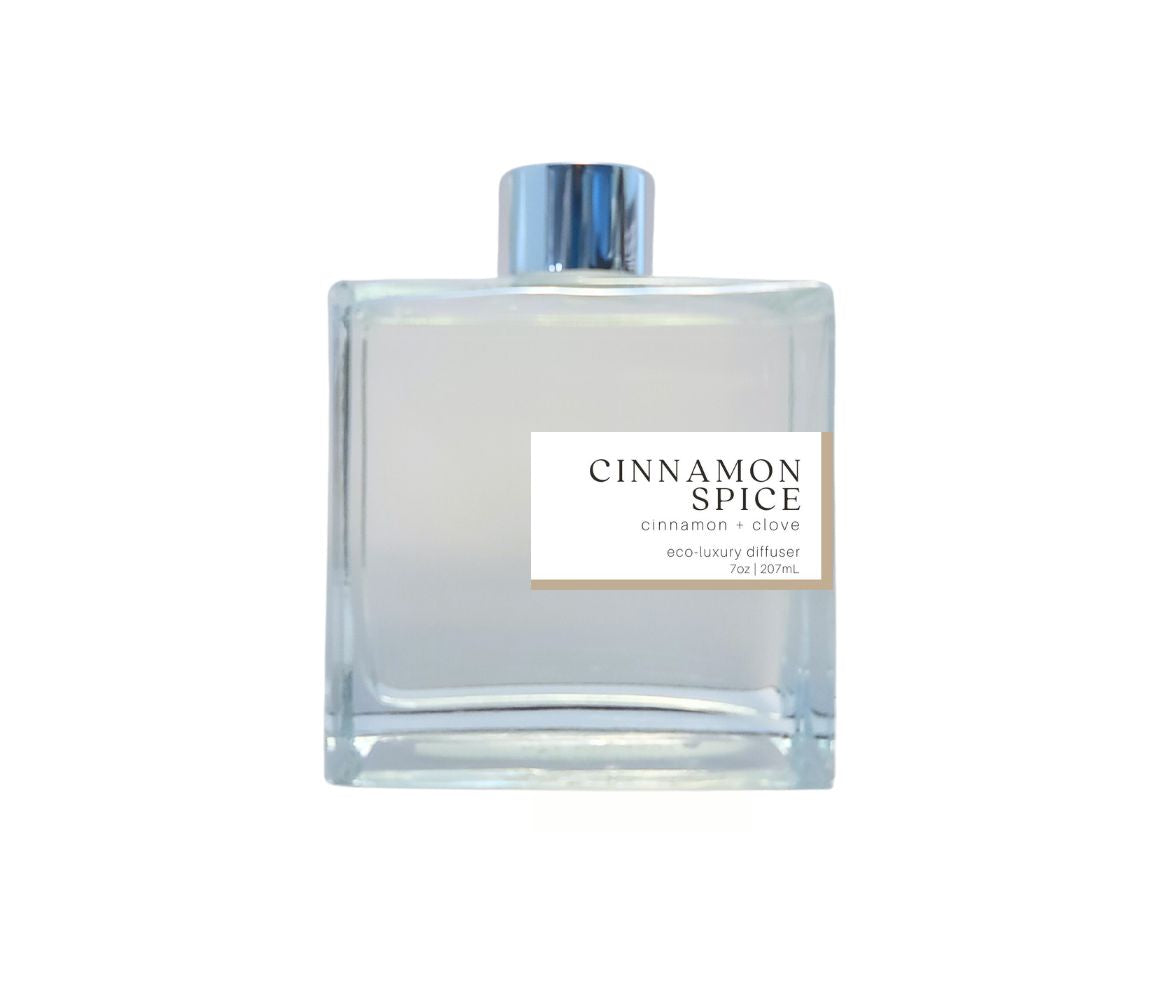 Cinnamon Spice reed diffuser by Green Koala in a glass bottle with silver cap, perfect for creating a cozy, welcoming atmosphere at home.