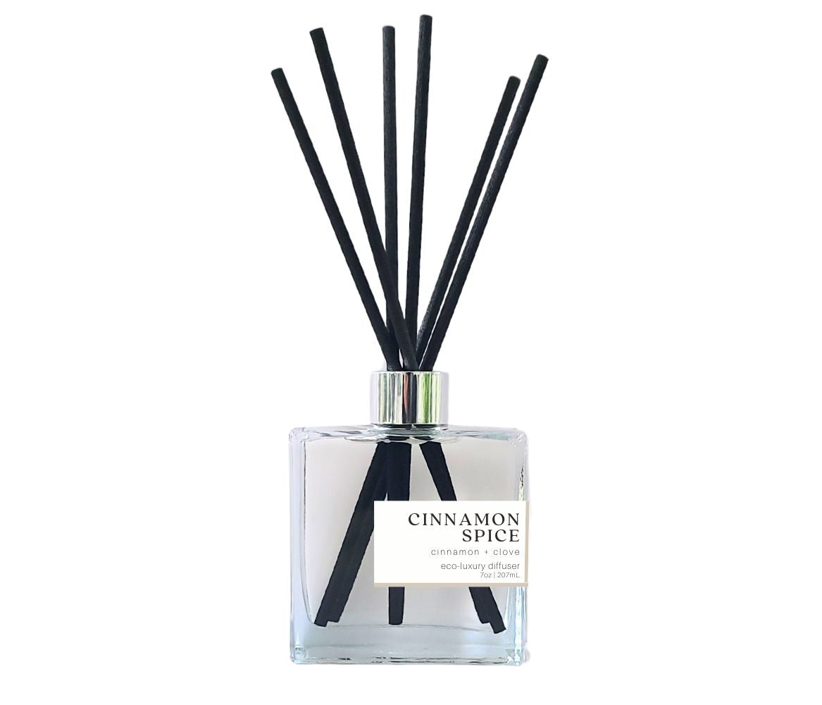 Green Koala Cinnamon Spice reed diffuser with black reeds in a stylish glass bottle, bringing a warm, aromatic fragrance to your home.