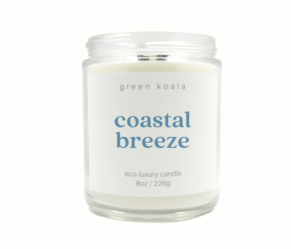 Candle in a glass jar labeled &