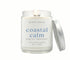 8oz Coastal Calm scented non-toxic and clean burning candle in a glass jar with silver lid.