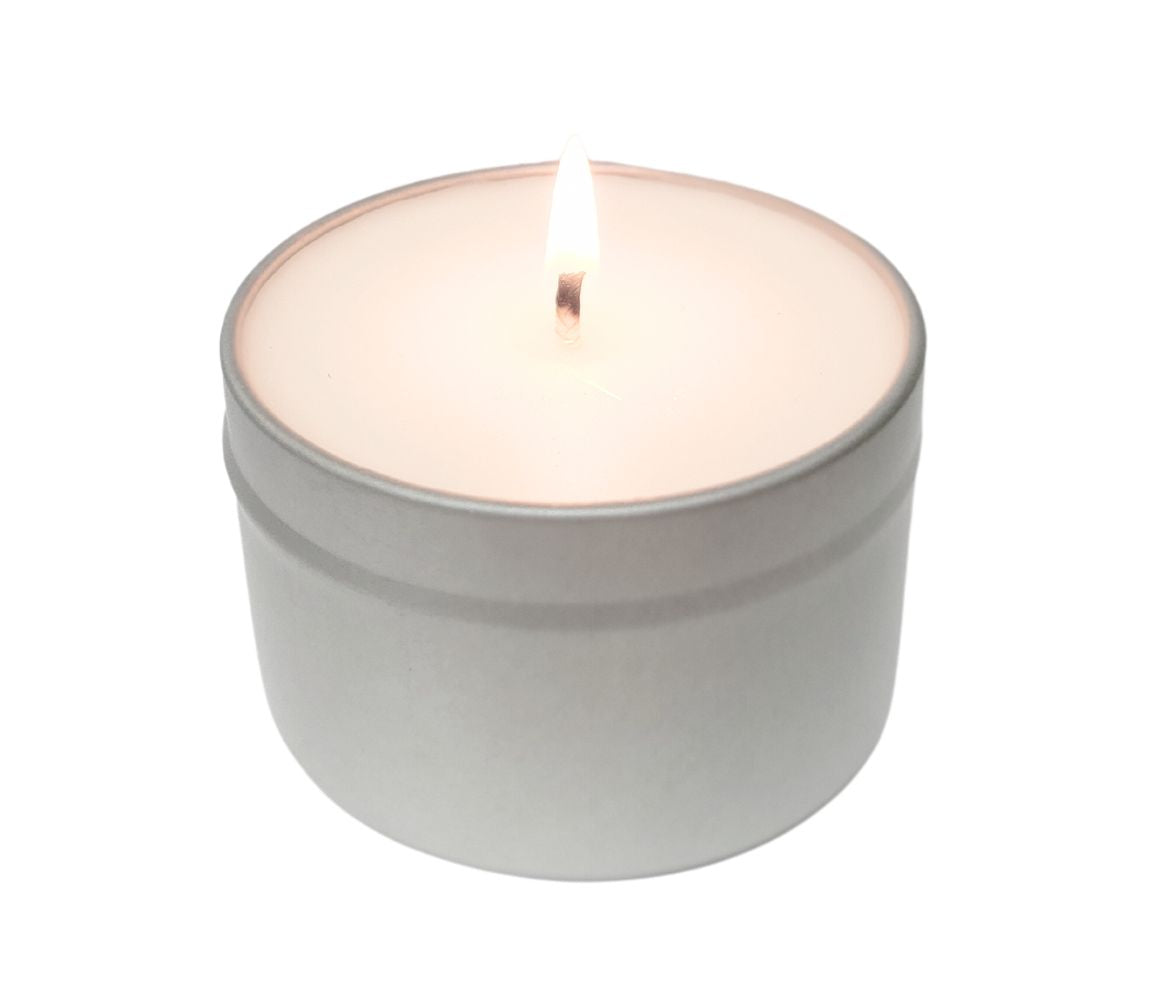 An Image of a burning Green Koala Organic Coastal Breeze scented Eco-Friendly Non-Toxic Candle 6oz Tin