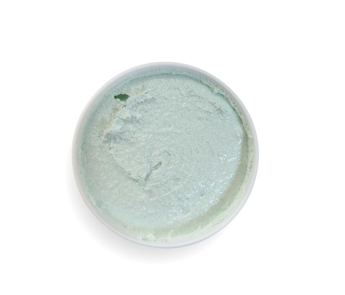 Top-down view of 9oz Coconut Lime Sugar Scrub jar showcasing whipped texture and tropical scent, exfoliates and hydrates skin.