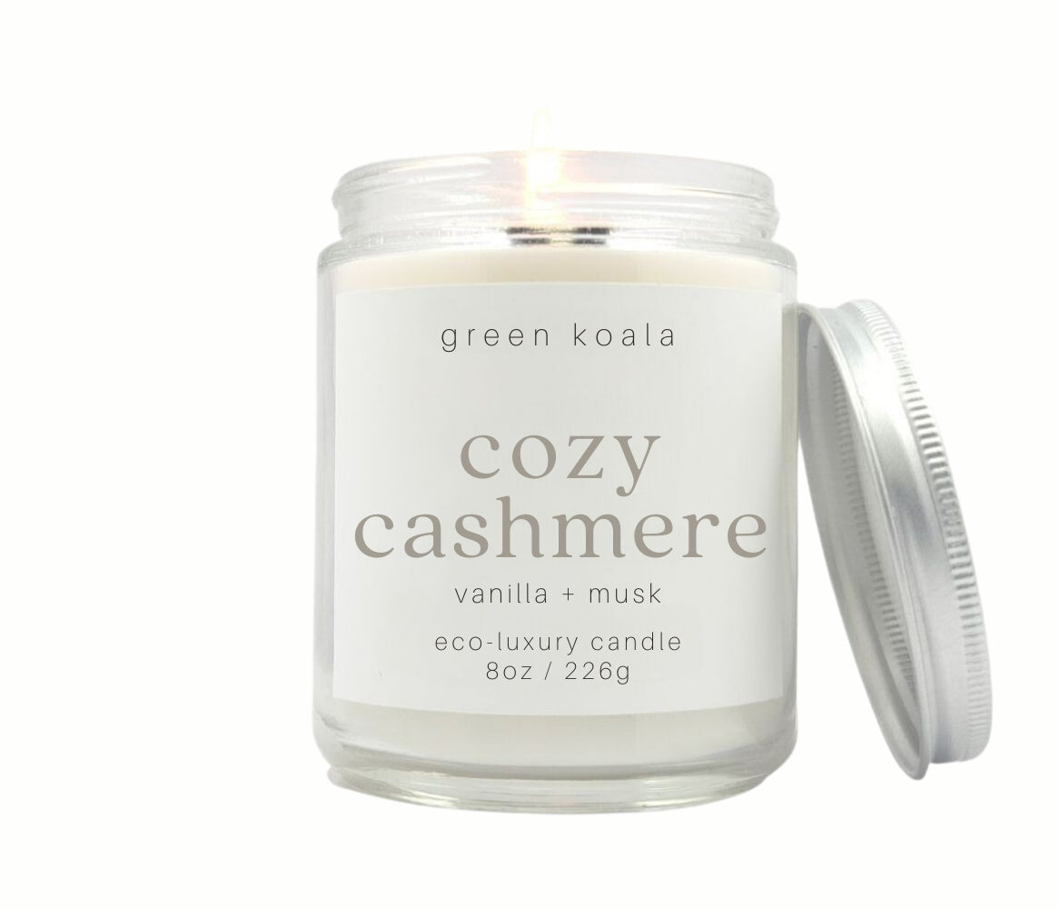 8oz Cozy Cashmere scented non-toxic and clean burning candle in a glass jar with silver lid.