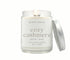 8oz Cozy Cashmere scented non-toxic and clean burning candle in a glass jar with silver lid.