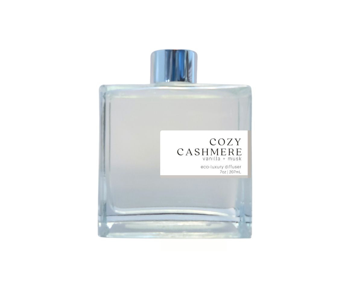 Eco-friendly Cozy Cashmere reed diffuser with silver cap, providing a soft, warm aroma perfect for creating a peaceful, cozy ambiance.