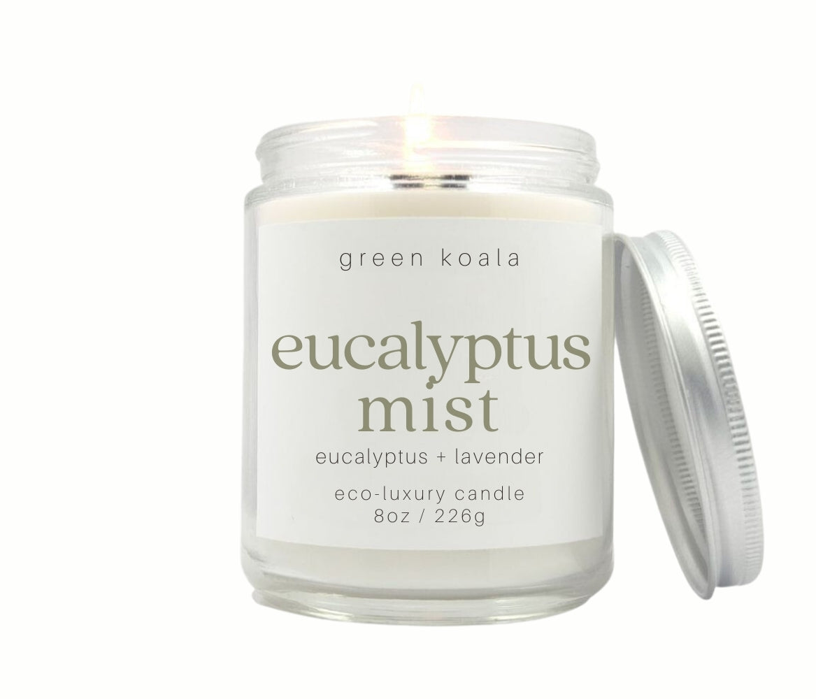 8oz Eucalyptus Mist scented non-toxic and clean burning candle in a glass jar with silver lid.