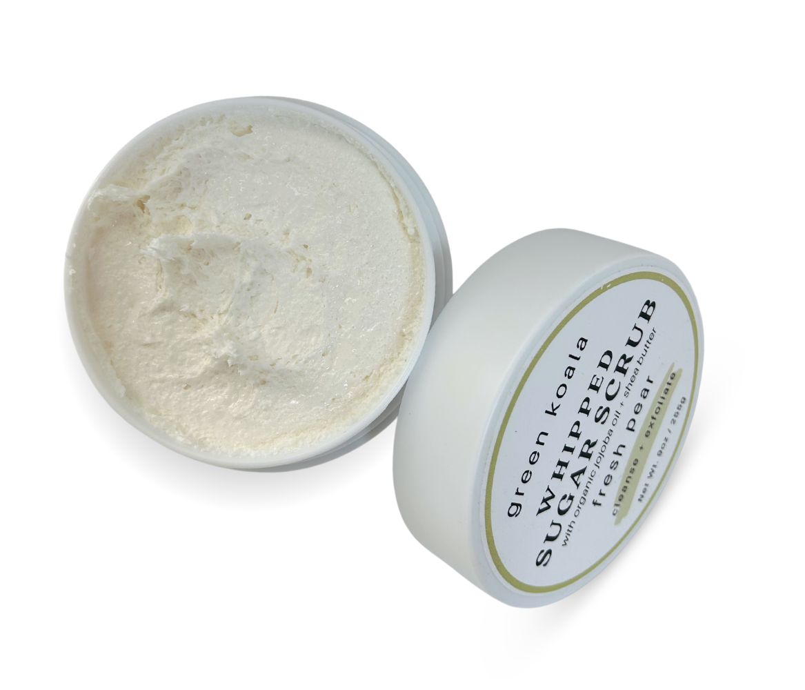 9oz Fresh Pear Sugar Scrub jar with whipped texture and lid leaning on side, gently cleanses, exfoliates, and hydrates skin.