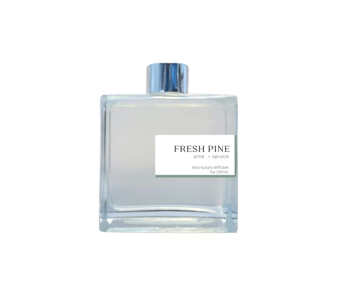 Fresh Pine reed diffuser by Green Koala in a sleek glass bottle with silver cap, filling your space with a refreshing, forest scent.