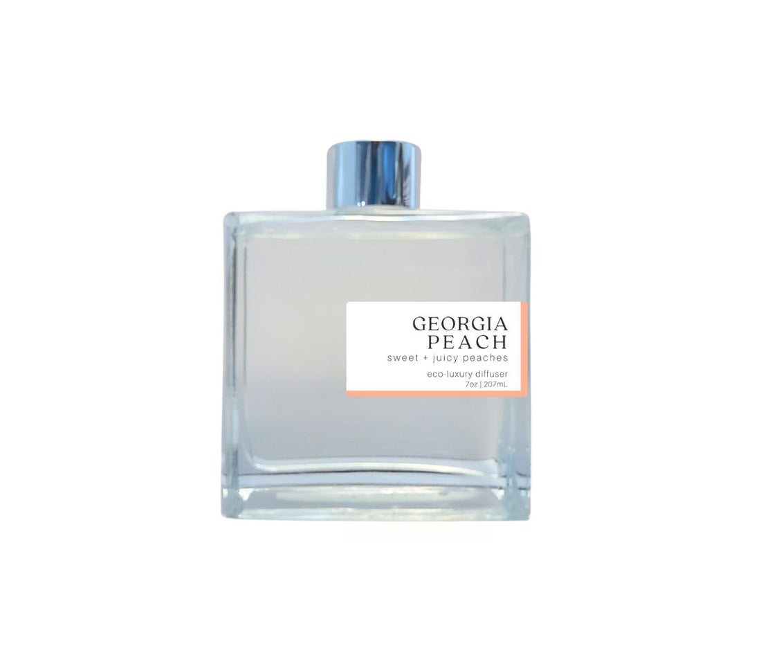 Georgia Peach 7oz non-toxic scented reed diffuser in glass jar.