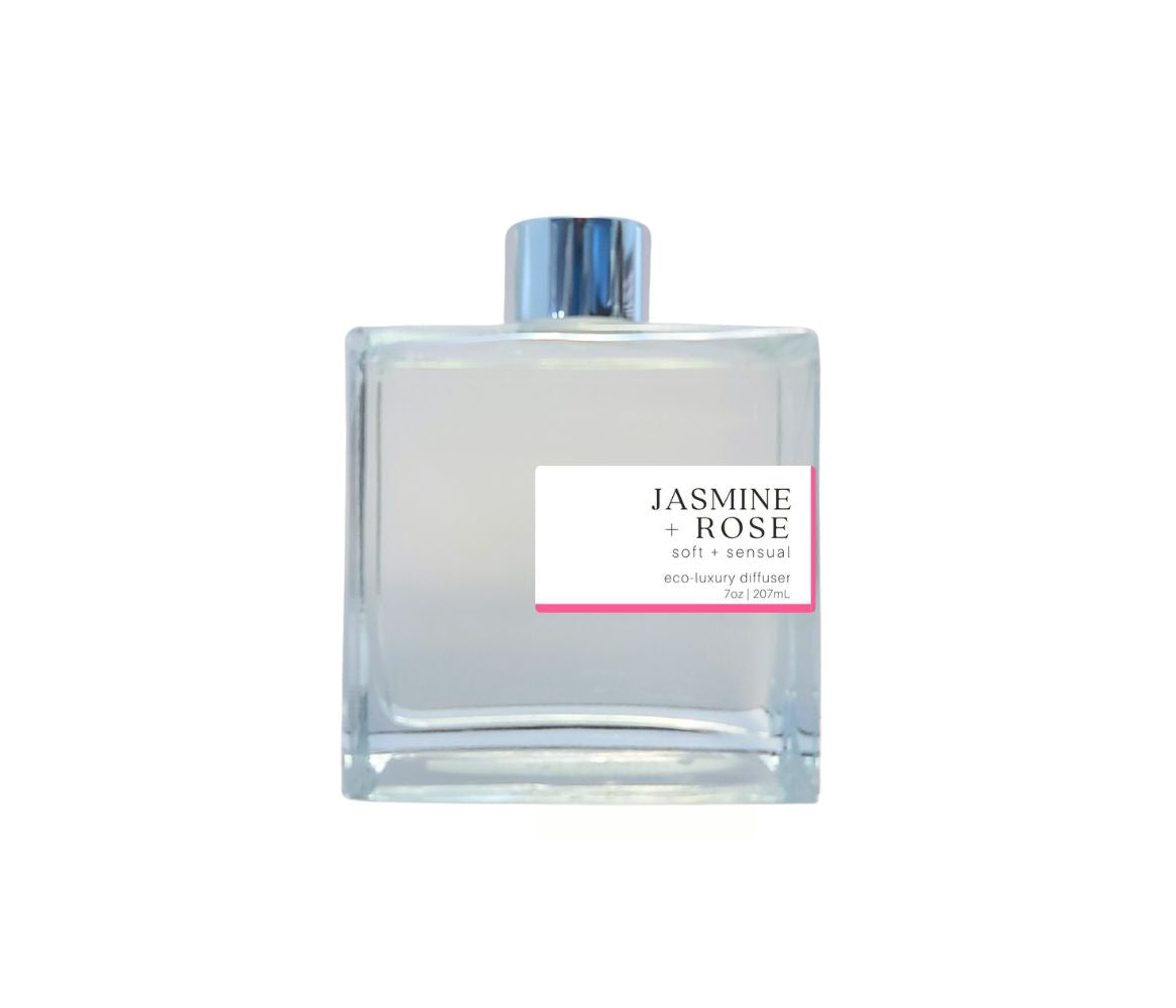 Green Koala Jasmine Rose reed diffuser in a clear glass bottle with silver cap, filling your space with a long-lasting floral scent.