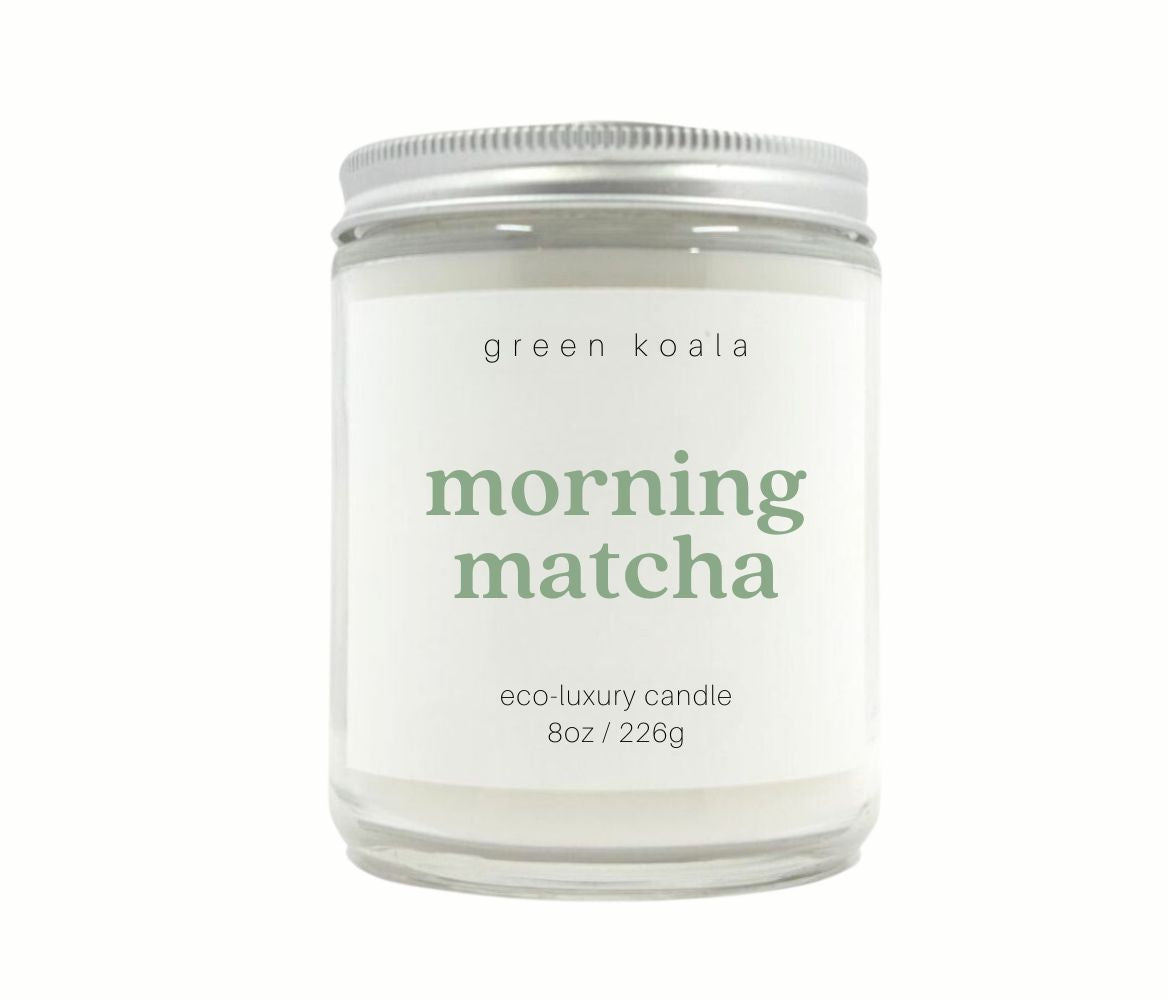 An 8oz Green Koala eco-friendly candle in a glass jar with a calming matcha scent.