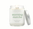 An 8oz Green Koala aromatic candle in a glass jar with a calming matcha scent, perfect for creating a cozy, serene atmosphere.