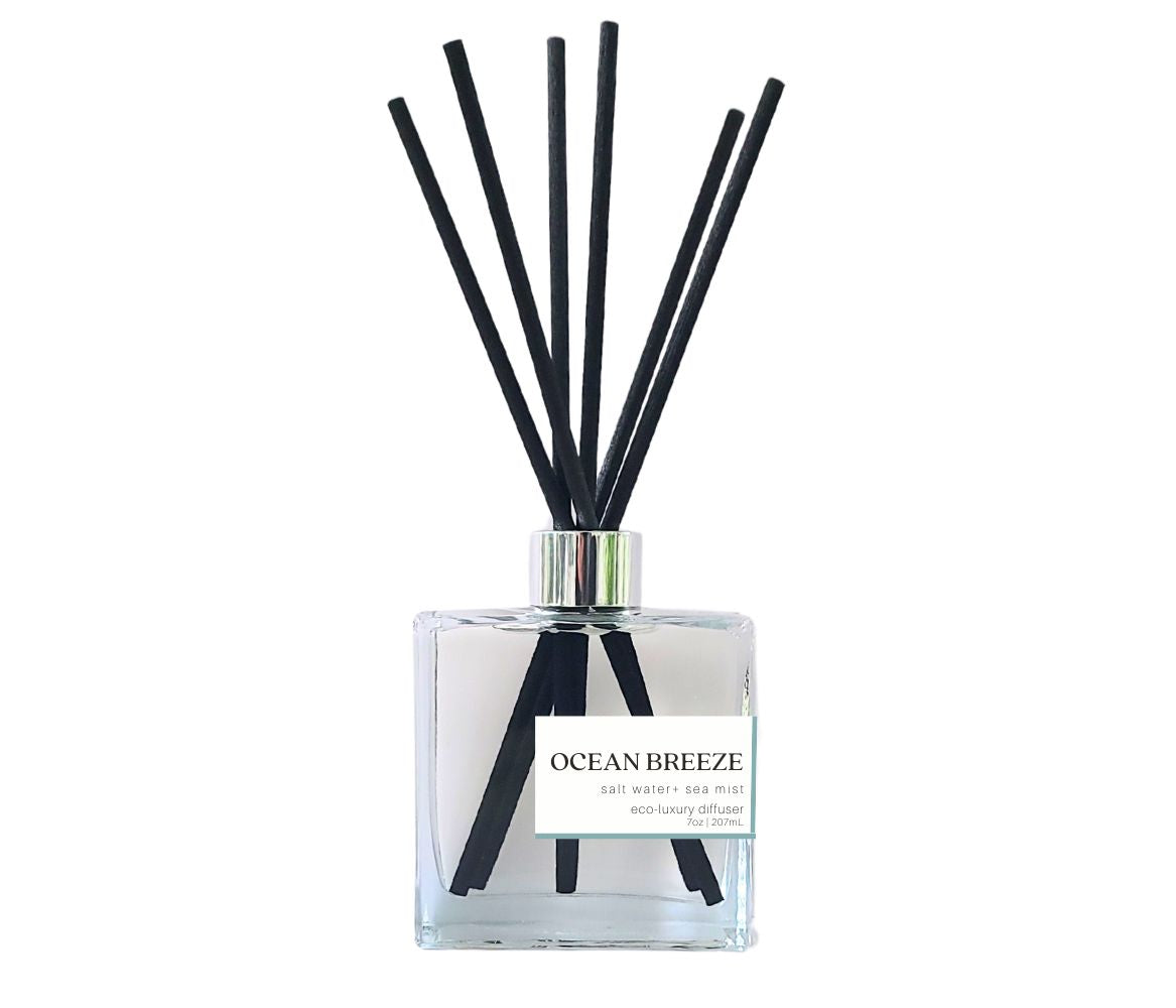 Ocean Breeze reed diffuser in a sleek glass square bottle with black reeds, perfect for a crisp, ocean-inspired vibe