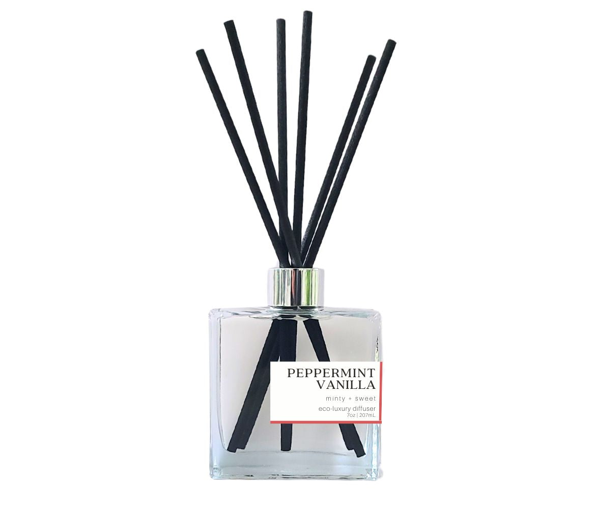 Green Koala Peppermint Vanilla reed diffuser in a glass bottle with black reeds, offering a cozy, sweet fragrance for your home.