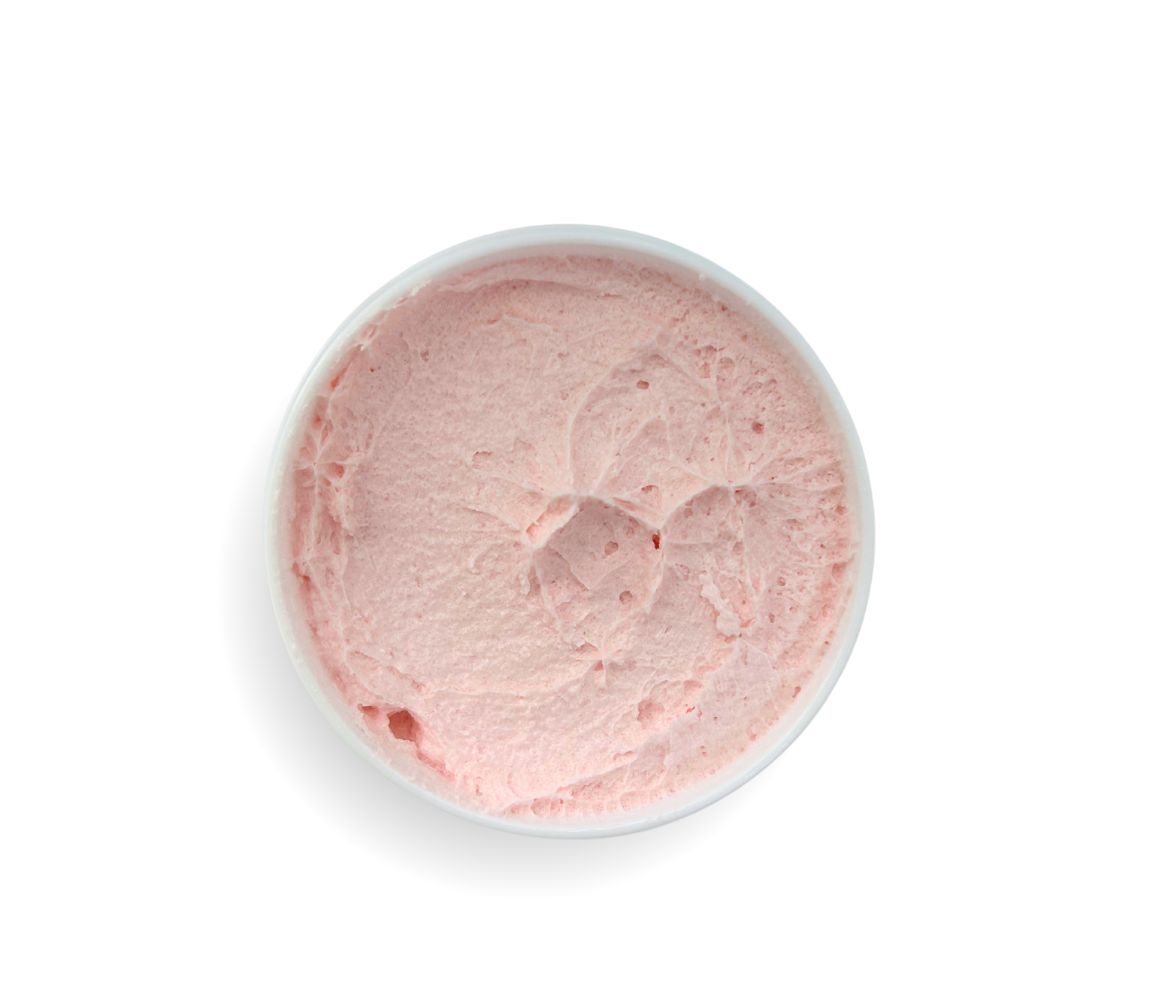Top-down view of 9oz Pink Grapefruit Sugar Body Scrub jar, showcasing whipped texture and vibrant citrus scent, cleanses, exfoliates, and hydrates skin.