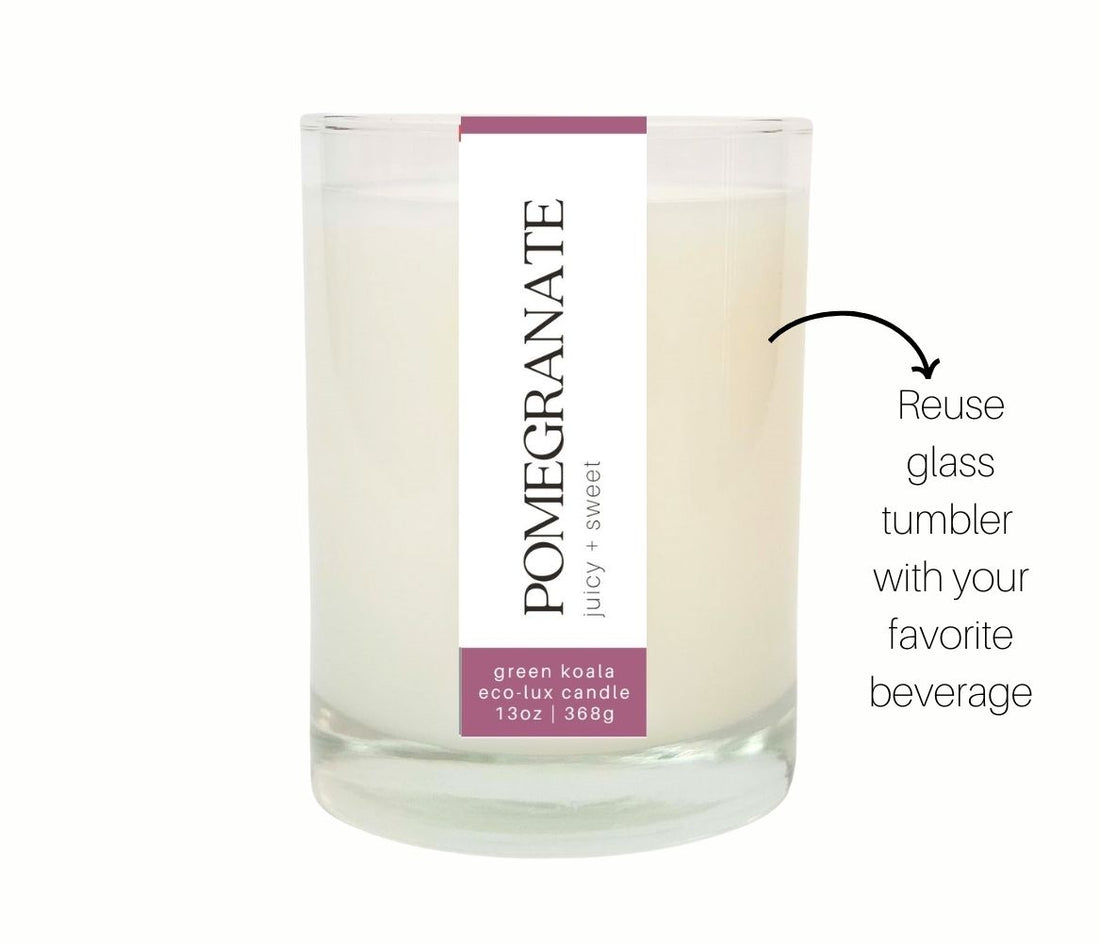 13oz Green Koala Pomegranate zero waste candle in a drinking glass