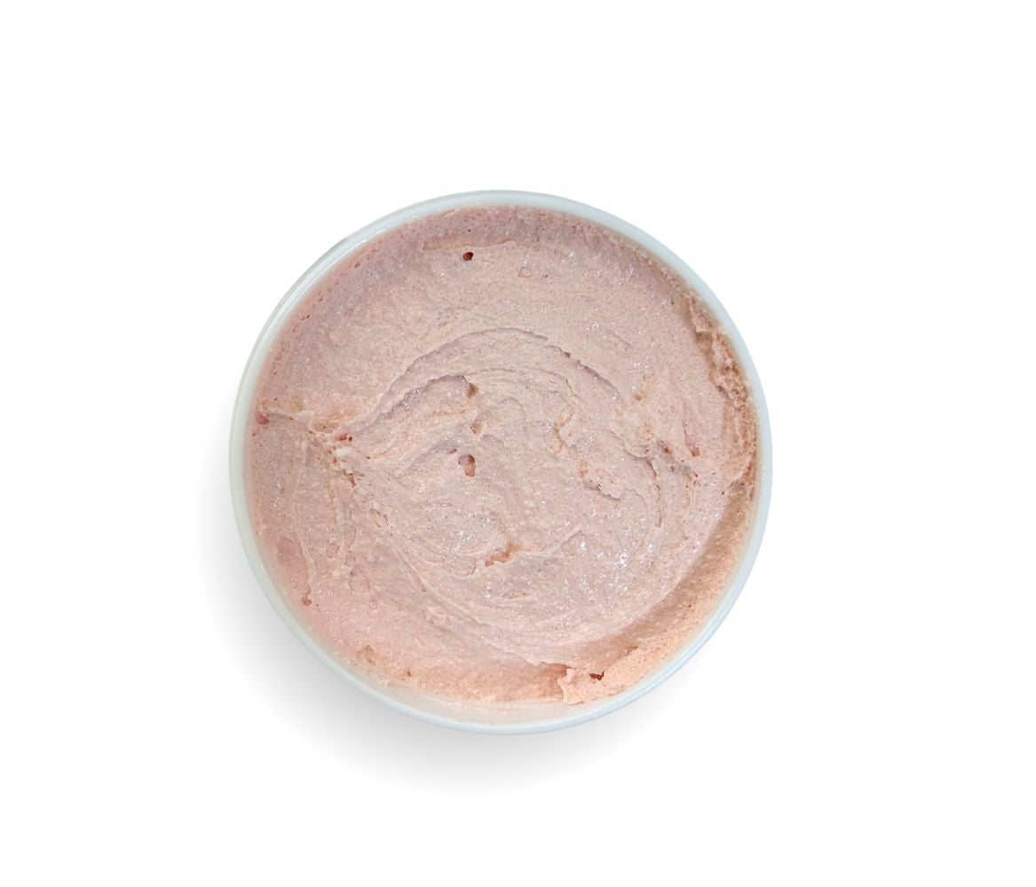 Top-down view of 9oz Pomegranate Sugar Body Scrub jar, showcasing whipped texture and sweet aroma, cleanses, exfoliates, and deeply hydrates skin.