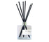Sea Spray + Sand reed diffuser in a glass bottle with black reeds, filling your space with a fresh, coastal fragrance.