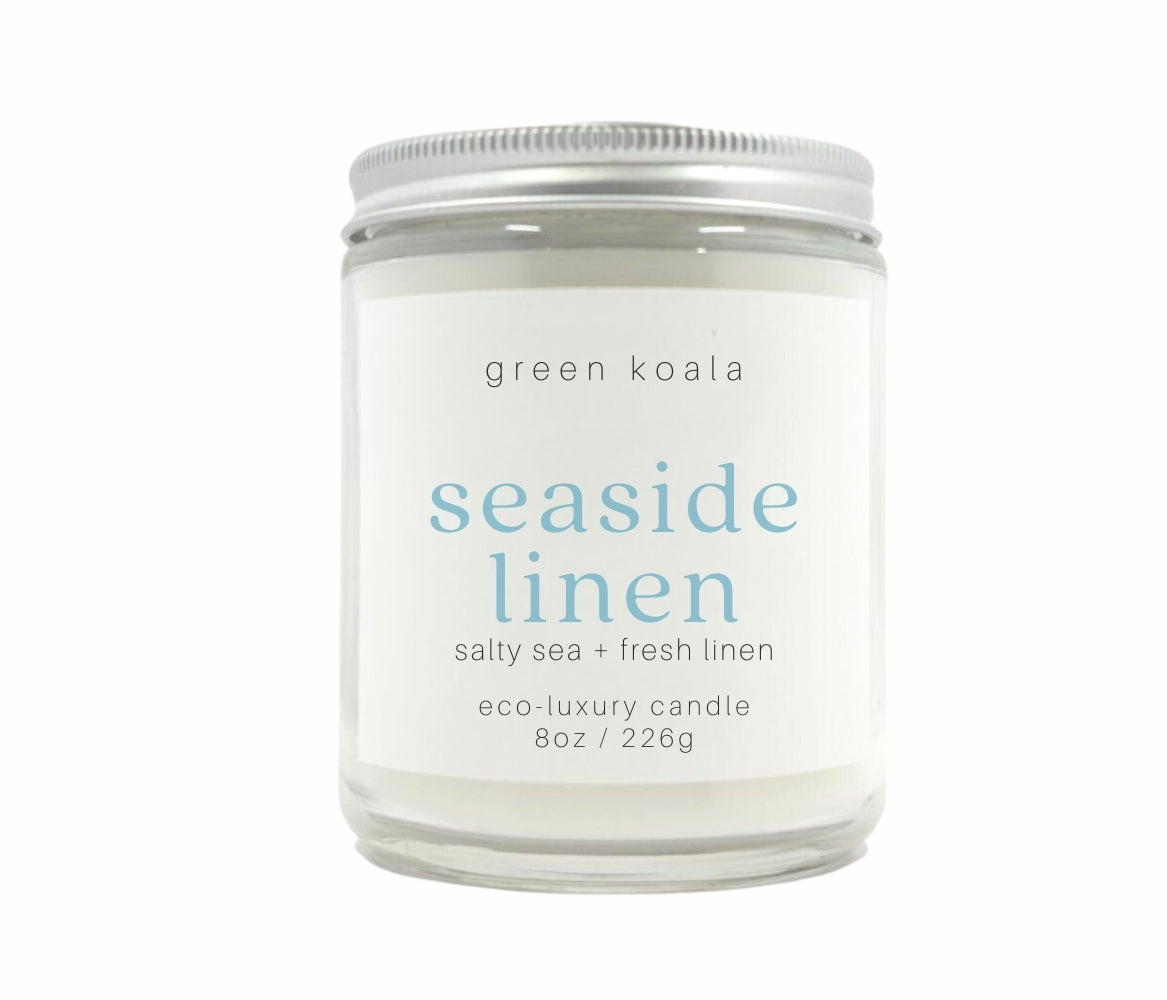 8oz Seaside Linen scented eco-friendly candle in a glass Jar with silver lid for a clean burn.
