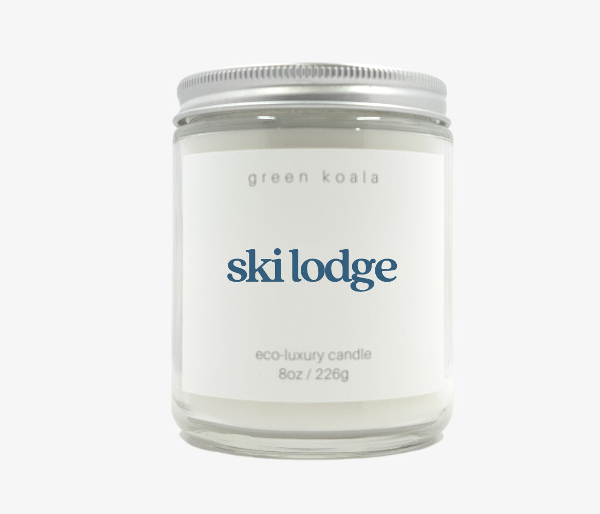 Green Koala Ski Lodge 8 oz. candle with lid on