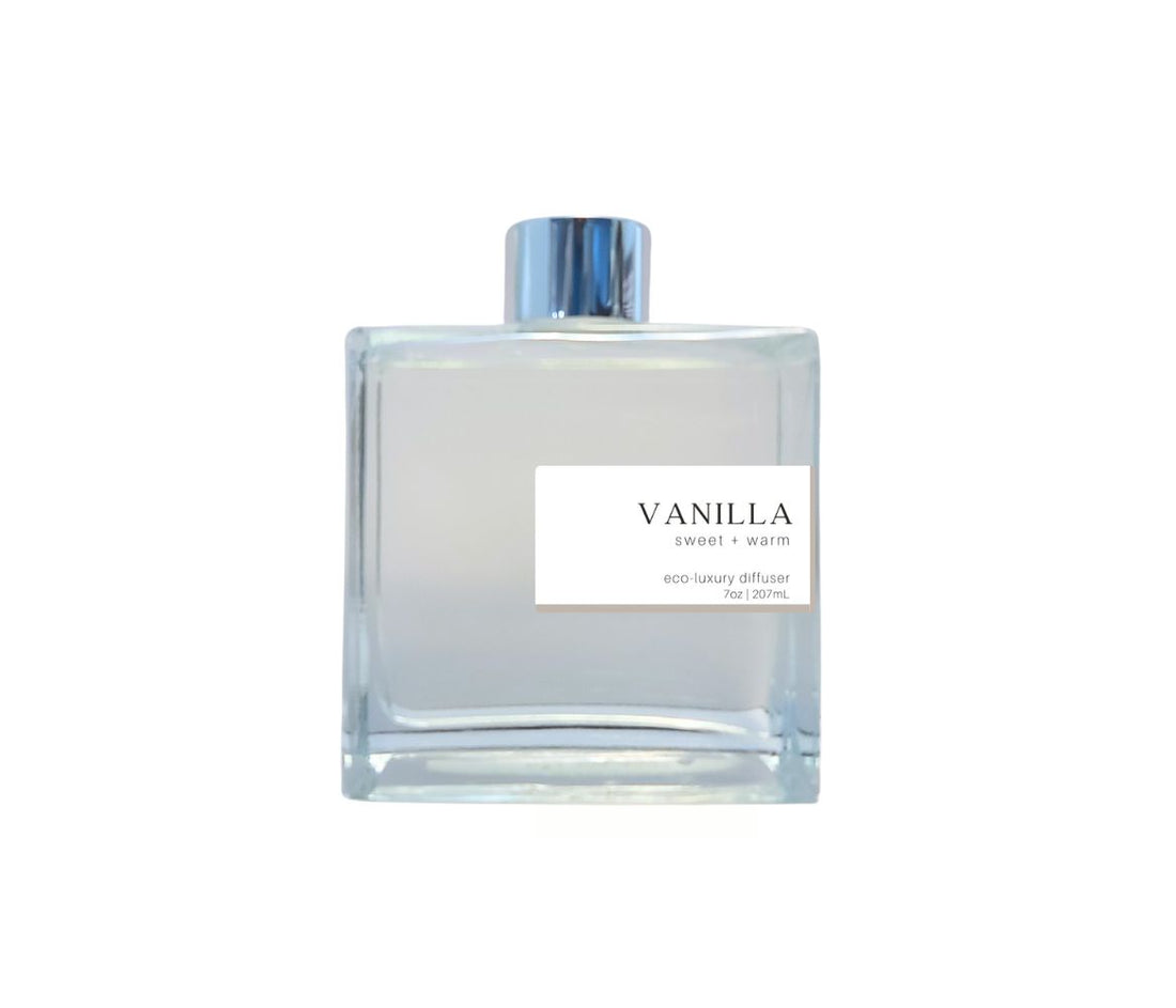 Hand-poured Vanilla reed diffuser in a glass bottle with silver cap, offering a long-lasting, comforting scent that fills your home with a soft, sweet aroma.