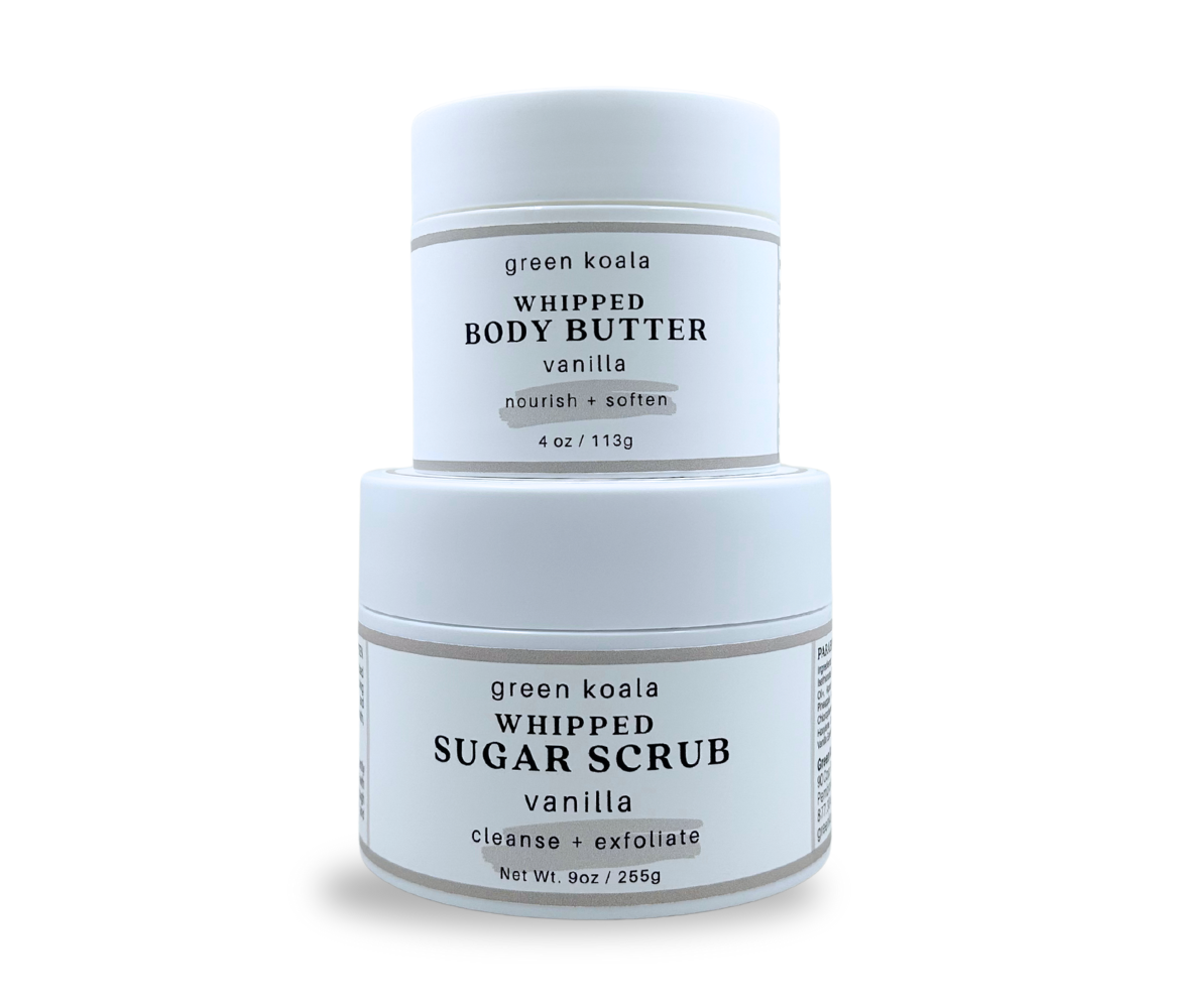 Nourishing gift set of green koala vanilla whipped body butter and sugar scrub on a white background