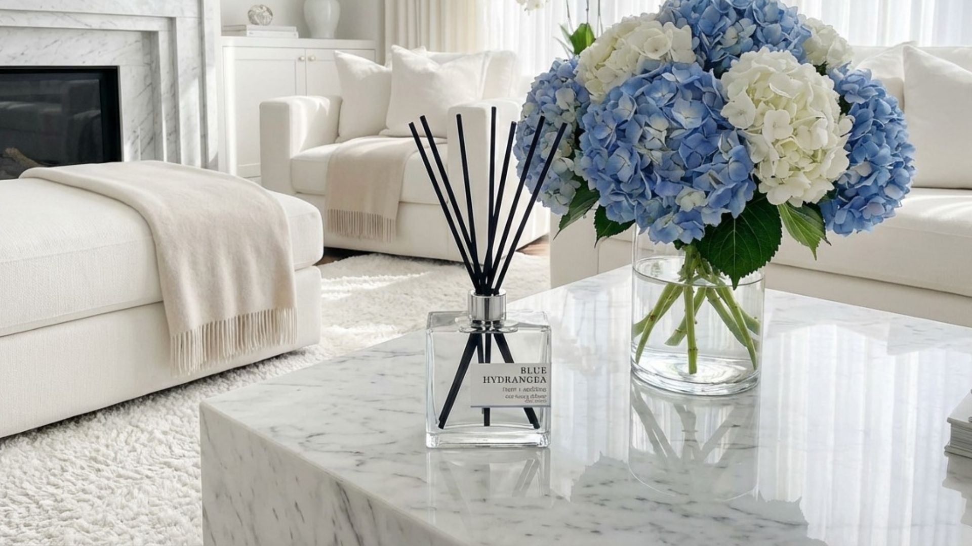 Hydrangea diffuser on a table with a vase of hydrangea flowers on a table