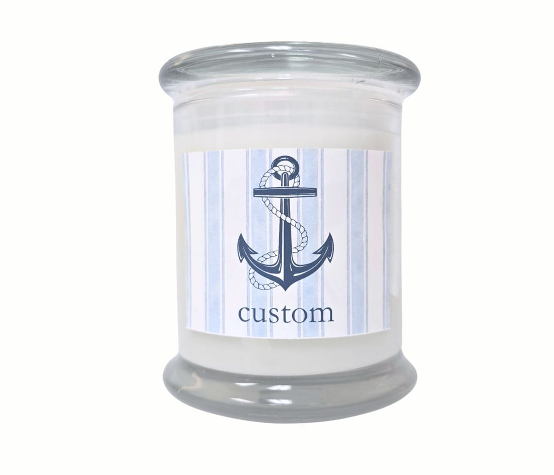 Personalized 12oz coastal candle with blue stripes and anchor icon, custom beach town label, hand-poured in eco-friendly coconut wax