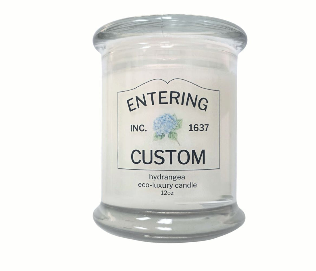 Personalized 12oz hydrangea candle with custom “Entering” town sign label, coordinates, and eco-friendly coconut wax blend
