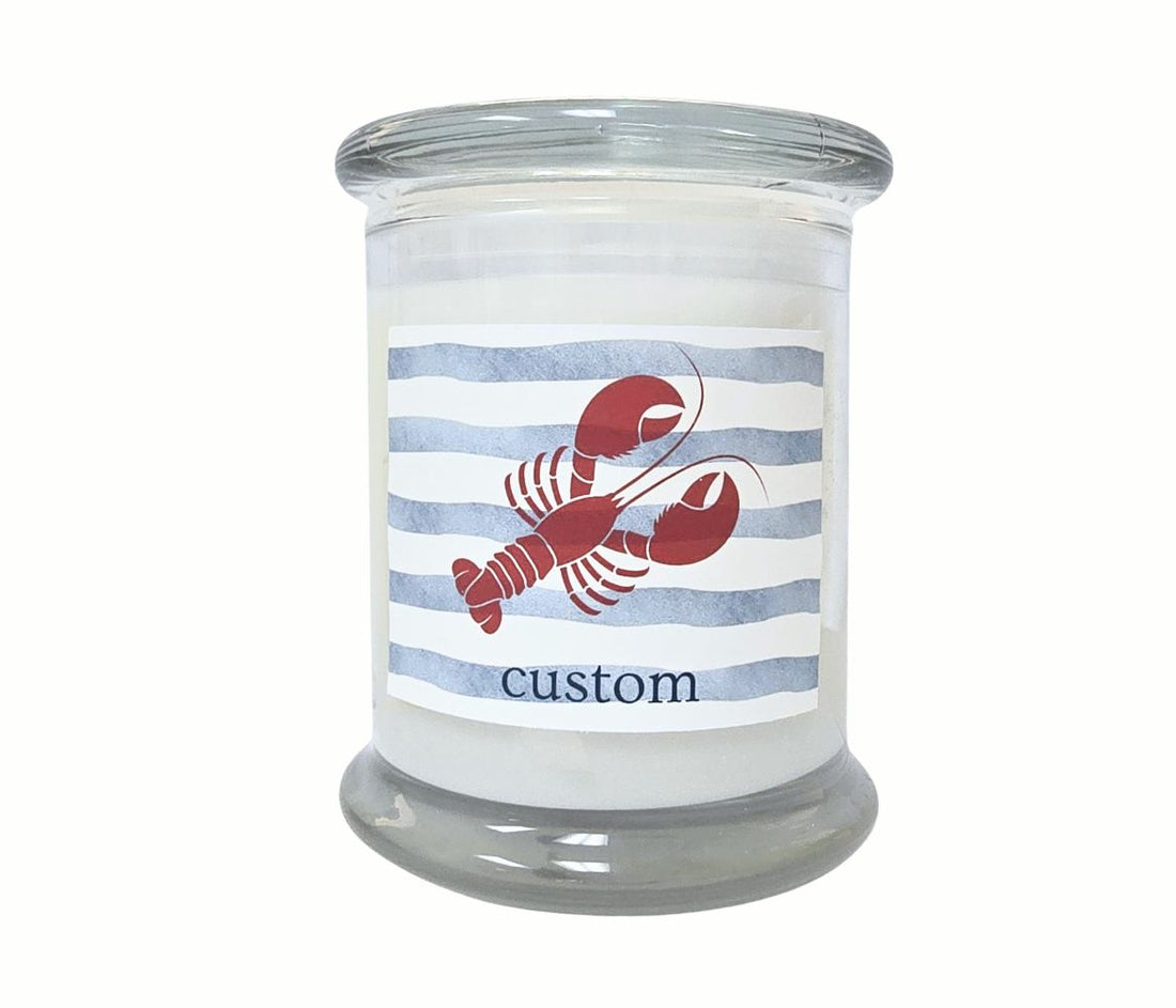 Personalized lobster with blue stripe 12oz candle in a glass jar, hand-poured and coastal-inspired.