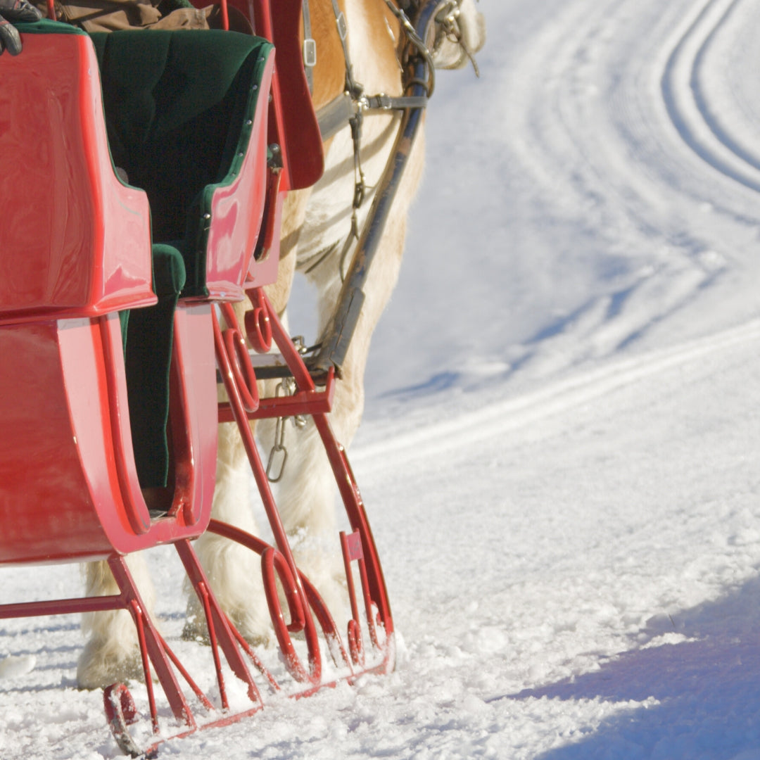 Image of a red sleigh on the snow. 