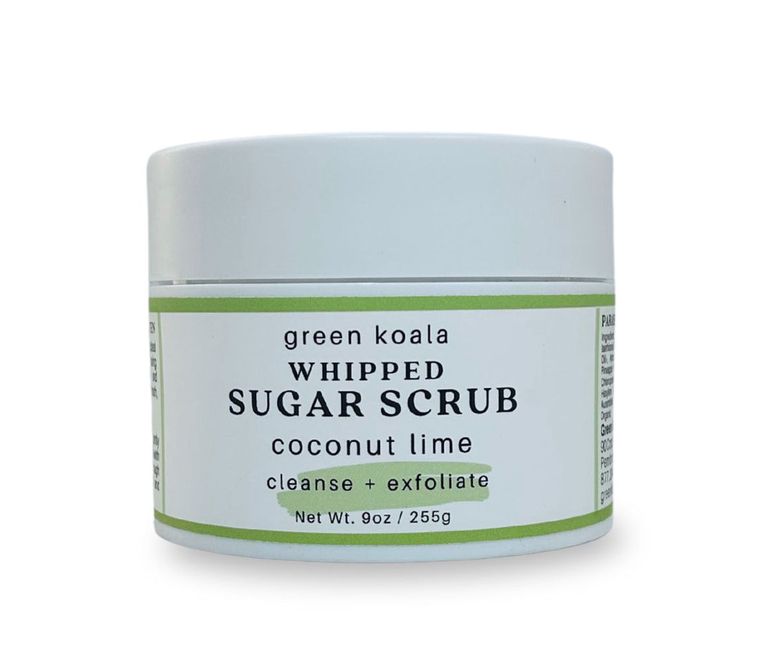 Side view of 9oz Coconut Lime Sugar Scrub jar displaying whipped texture and tropical scent, exfoliates and hydrates skin.