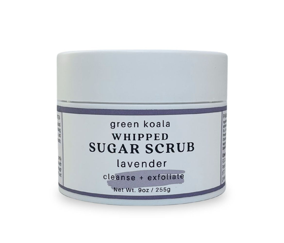 Front view of 9oz Lavender Sugar Body Scrub jar with soothing floral label, showcasing whipped texture and calming lavender scent, cleanses, exfoliates and hydrates skin.