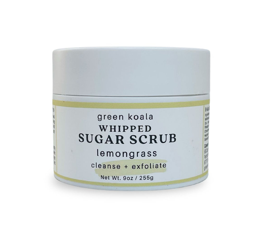 Front view of 9oz Lemongrass Sugar Body Scrub jar with label, showcasing whipped texture and citrusy lemongrass scent, exfoliates and hydrates skin.