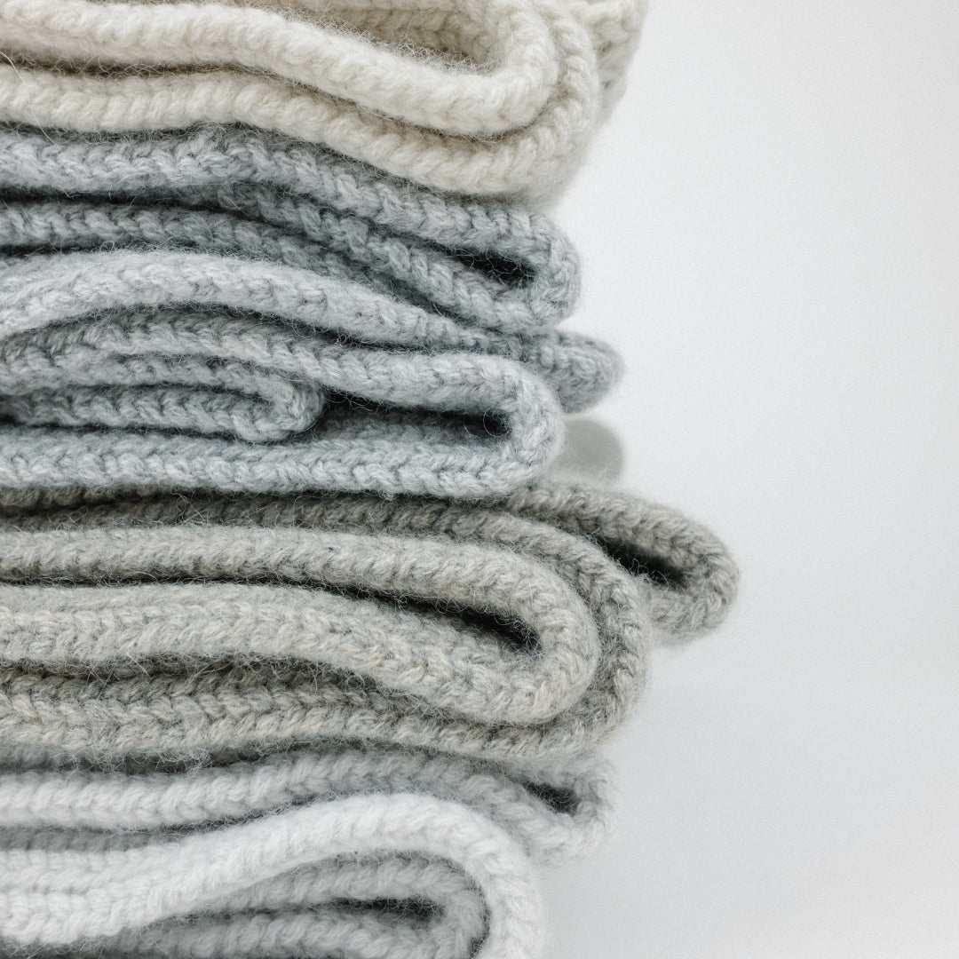 stack of cashmere sweaters