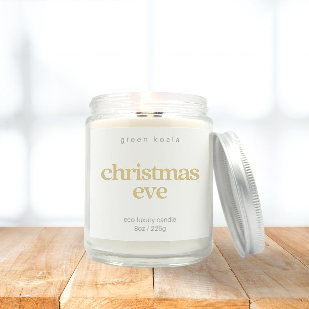 8oz Christmas Eve scented coconut wax candle in a glass jar with silver lid. 