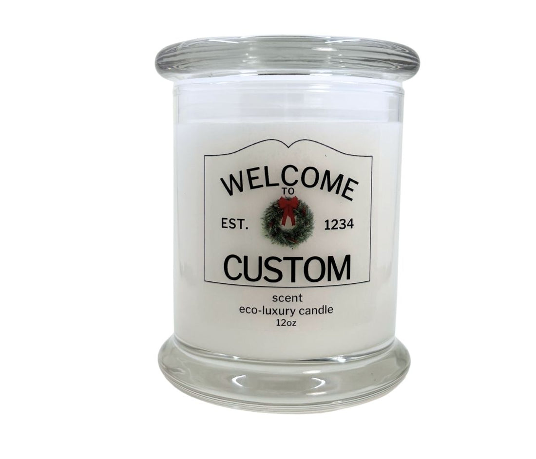 12oz Holiday “Entering Your Town” custom candle with wreath icon, personalized label, hand-poured in eco-friendly coconut wax